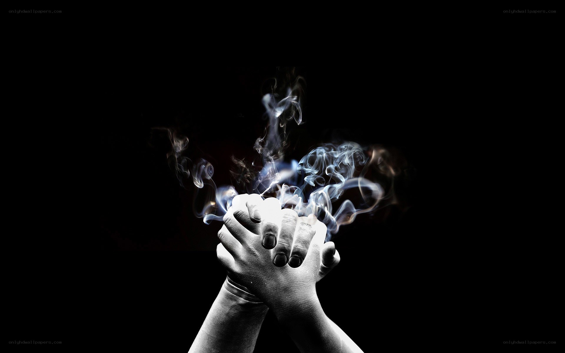 hands with smoke