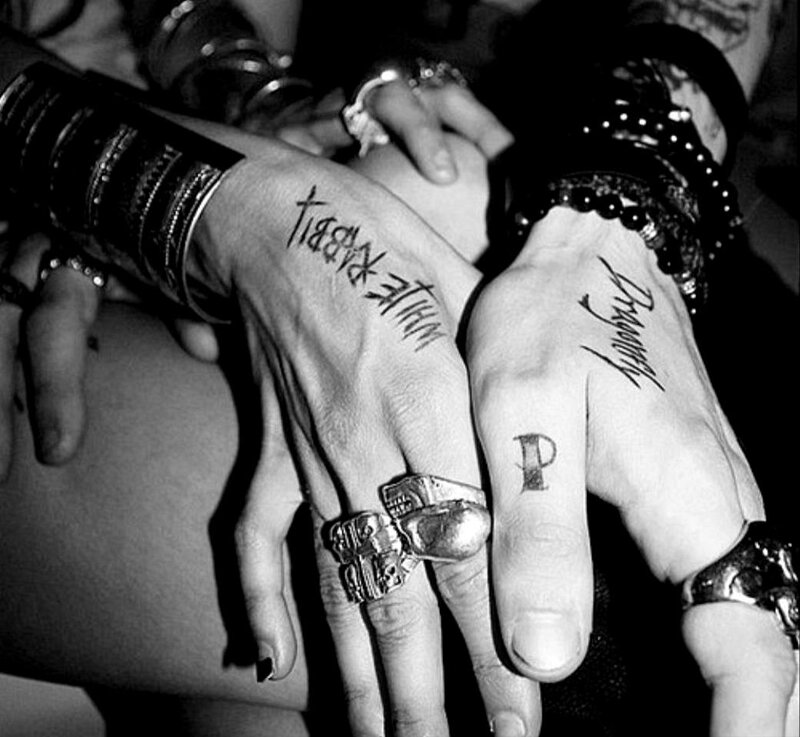 Hands with Tattoos and Rings