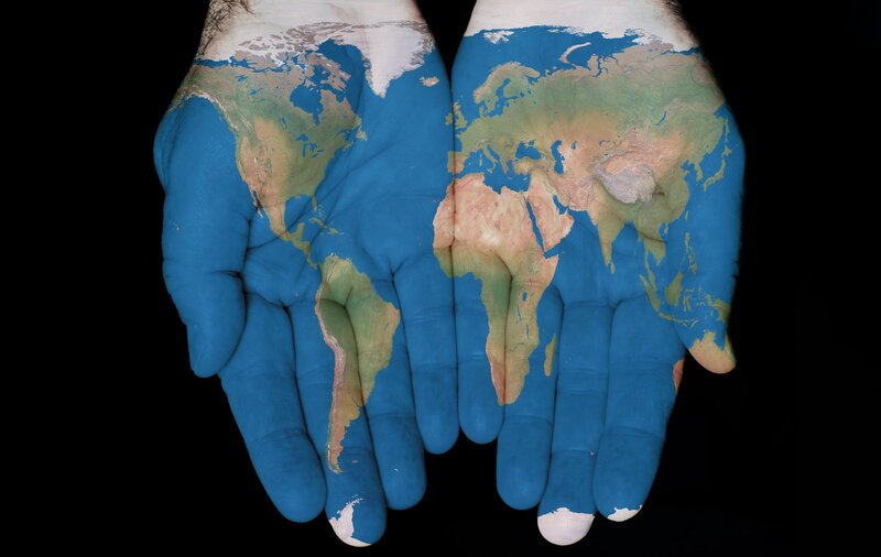 Hands with World Map — Blue, Dramatic