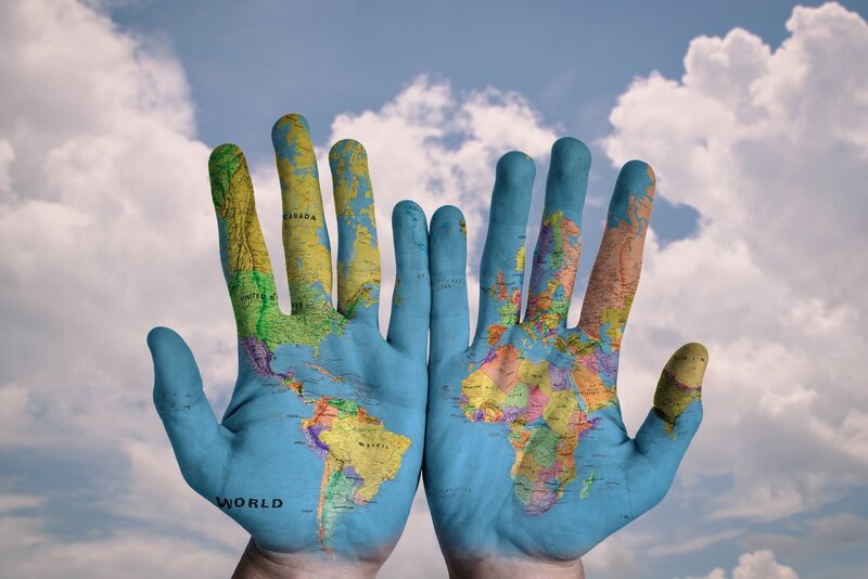 Hands with World Map — Blue, Peaceful