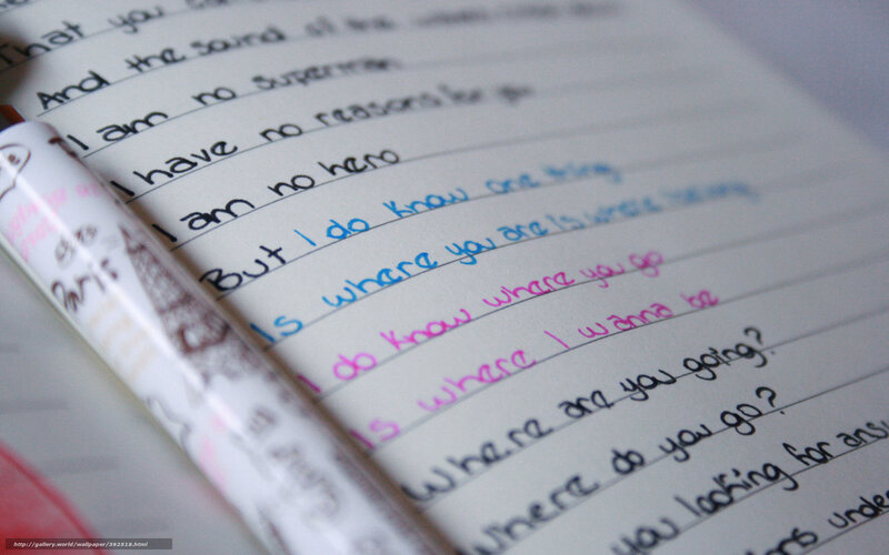 handwritten lyrics in notebook