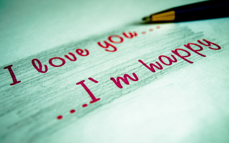 Handwritten Note on Paper — Red