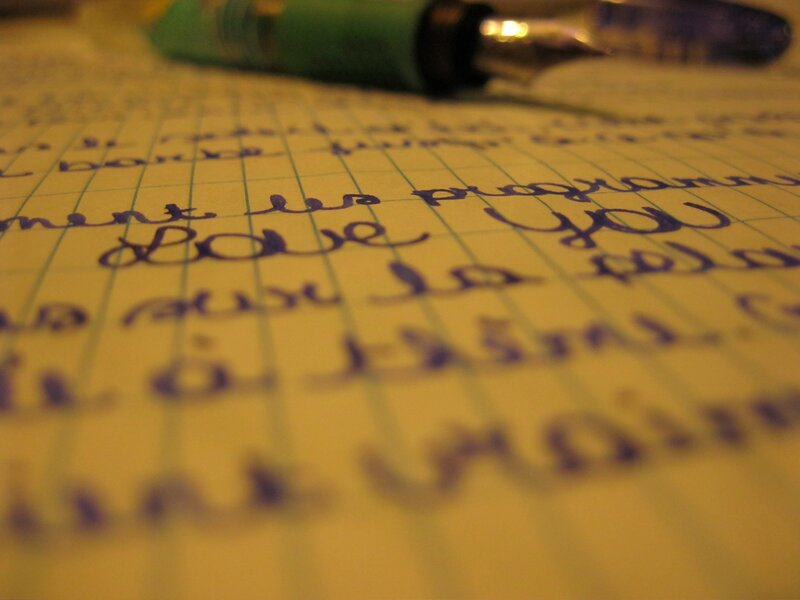handwritten note with pen