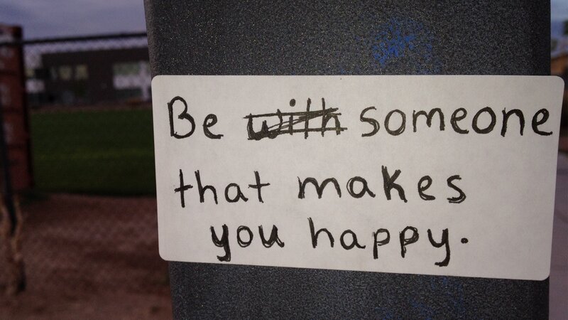 handwritten sign with altered message
