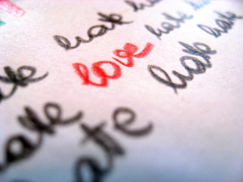 Handwritten word 'love' in red