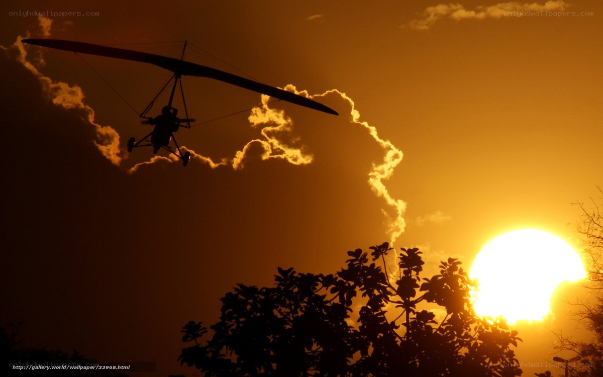 Hang glider at sunset