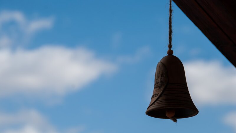 Hanging Bell Against Sky