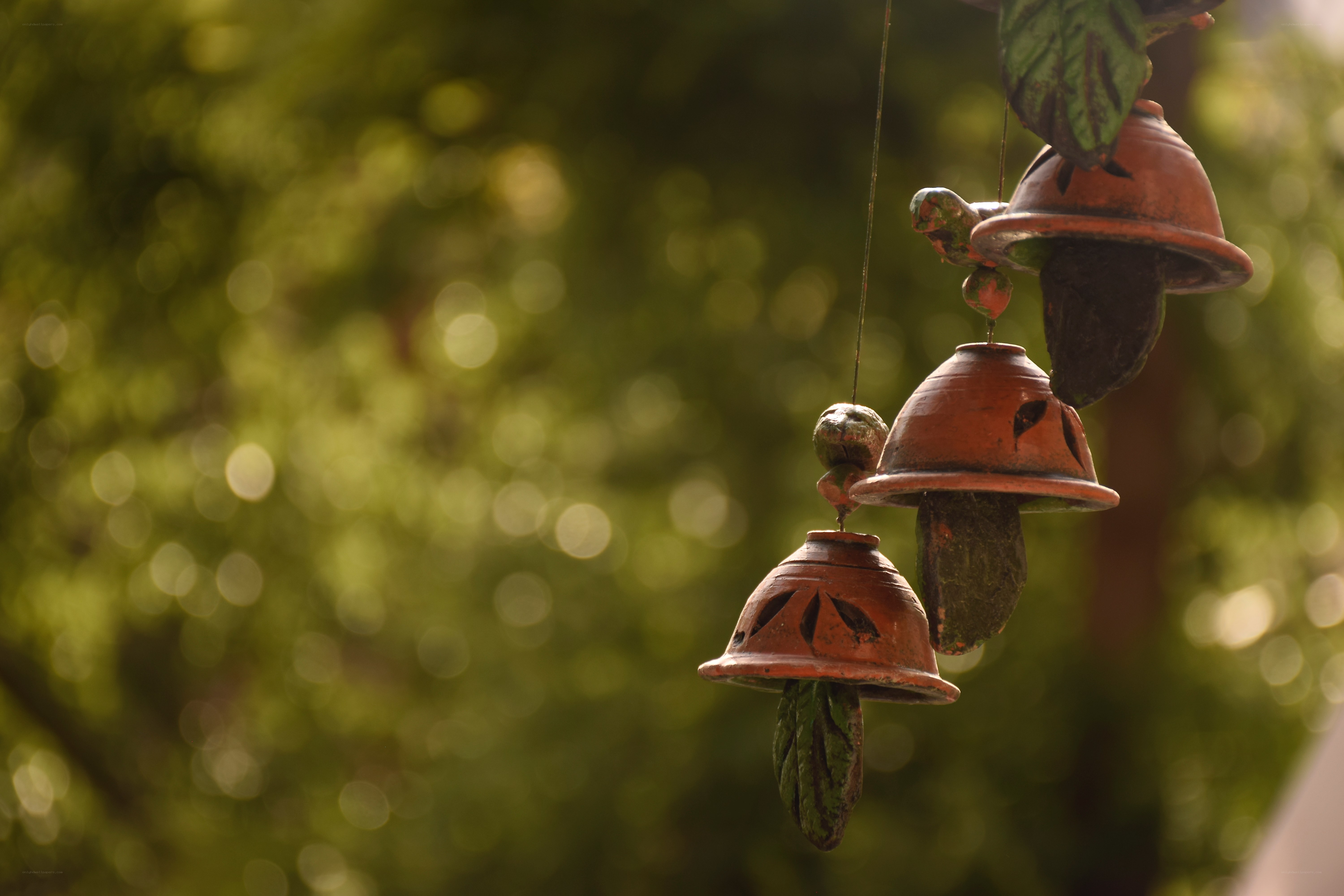 hanging clay bells in garden