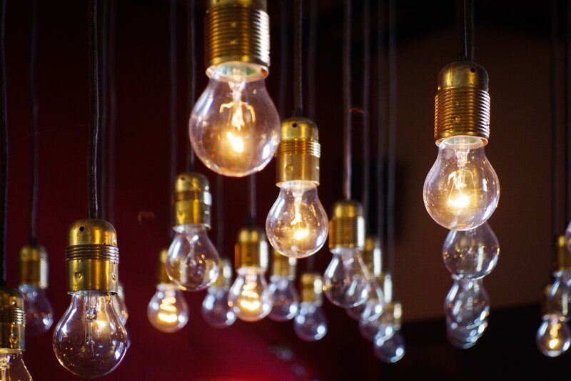 Hanging light bulbs in warm glow