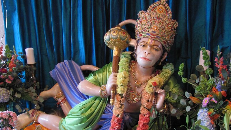 Hanuman statue with flowers