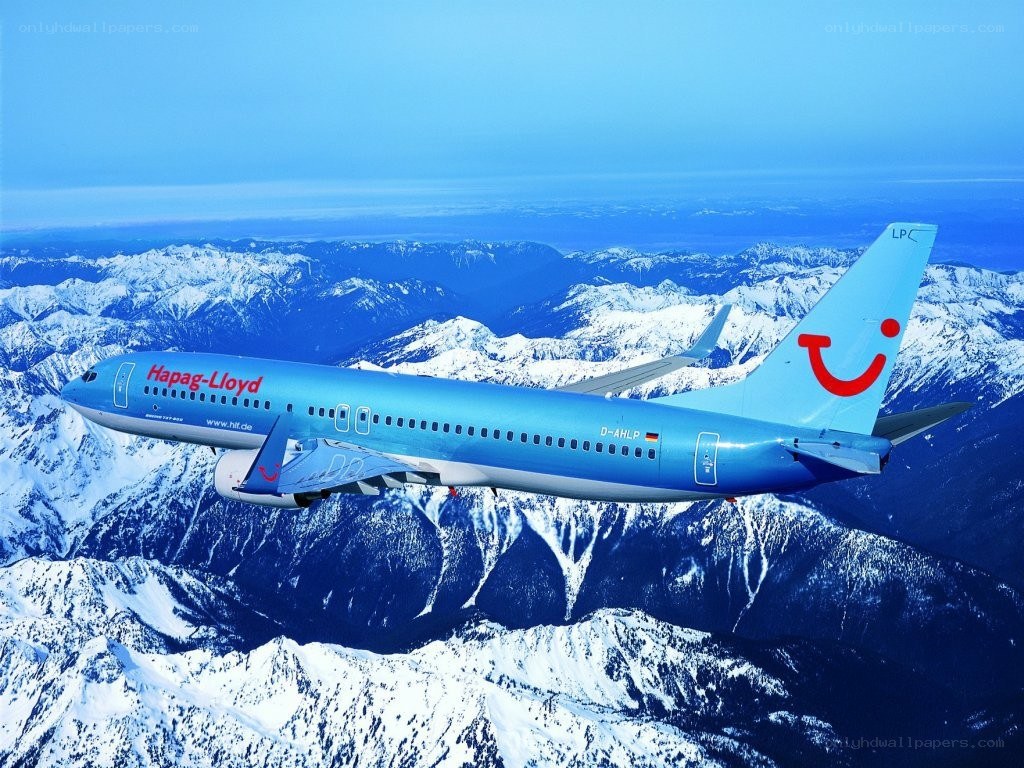 Hapag-Lloyd airplane over mountains
