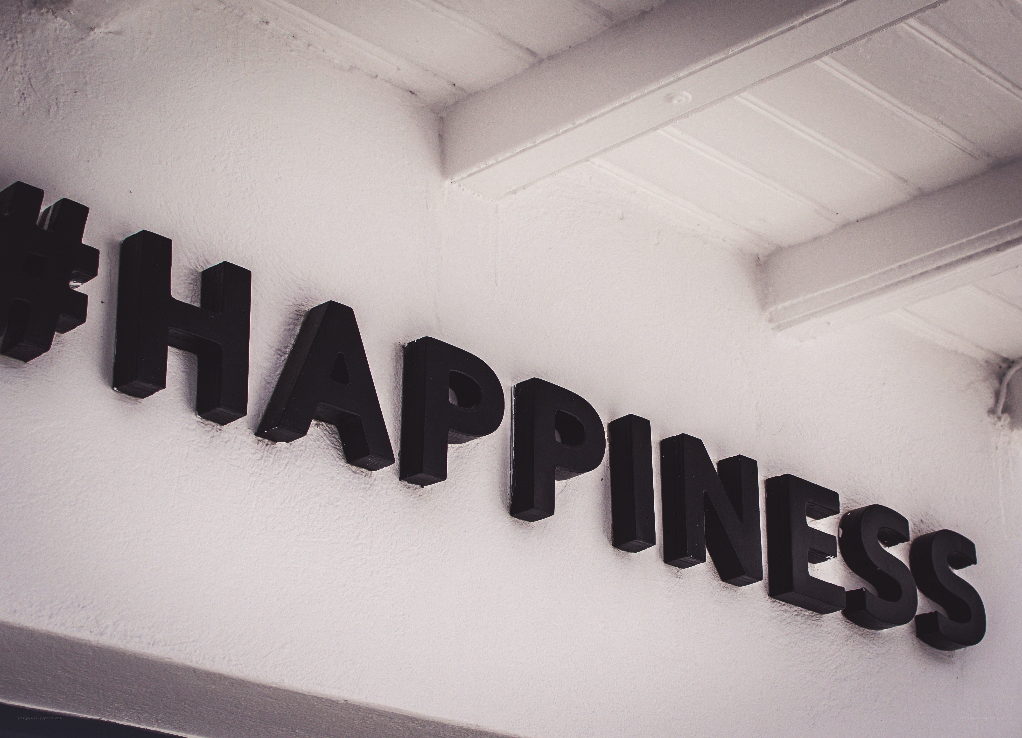 #happiness sign on wall