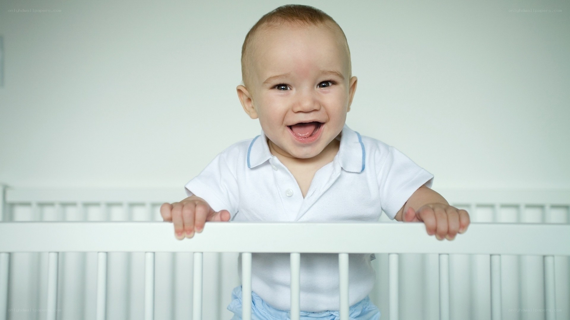 happy baby in crib