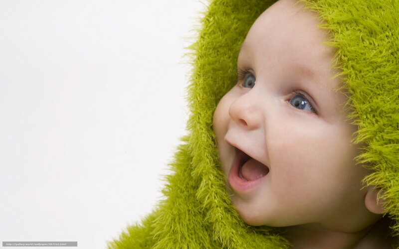 happy baby in green hood