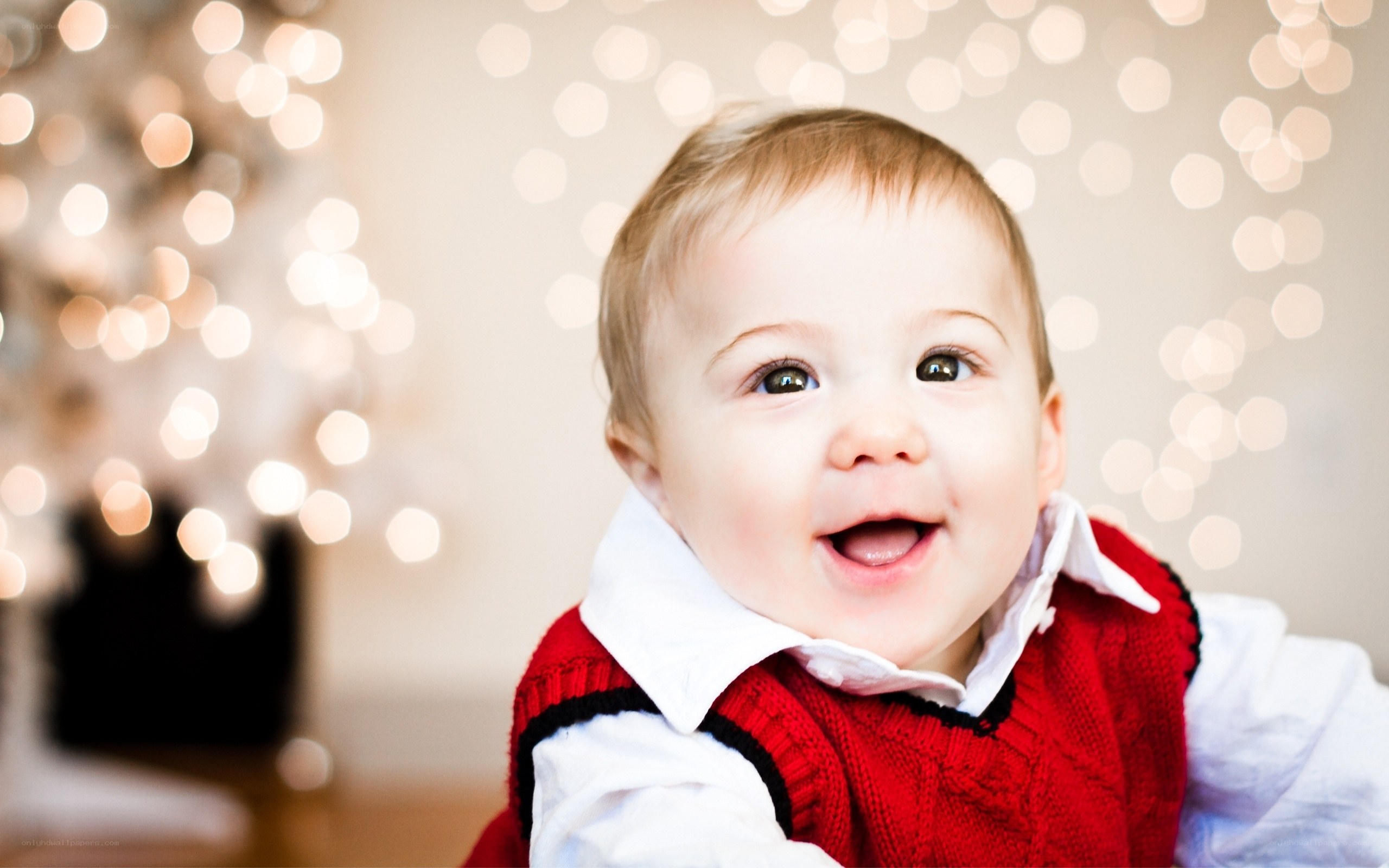 happy baby in red sweater
