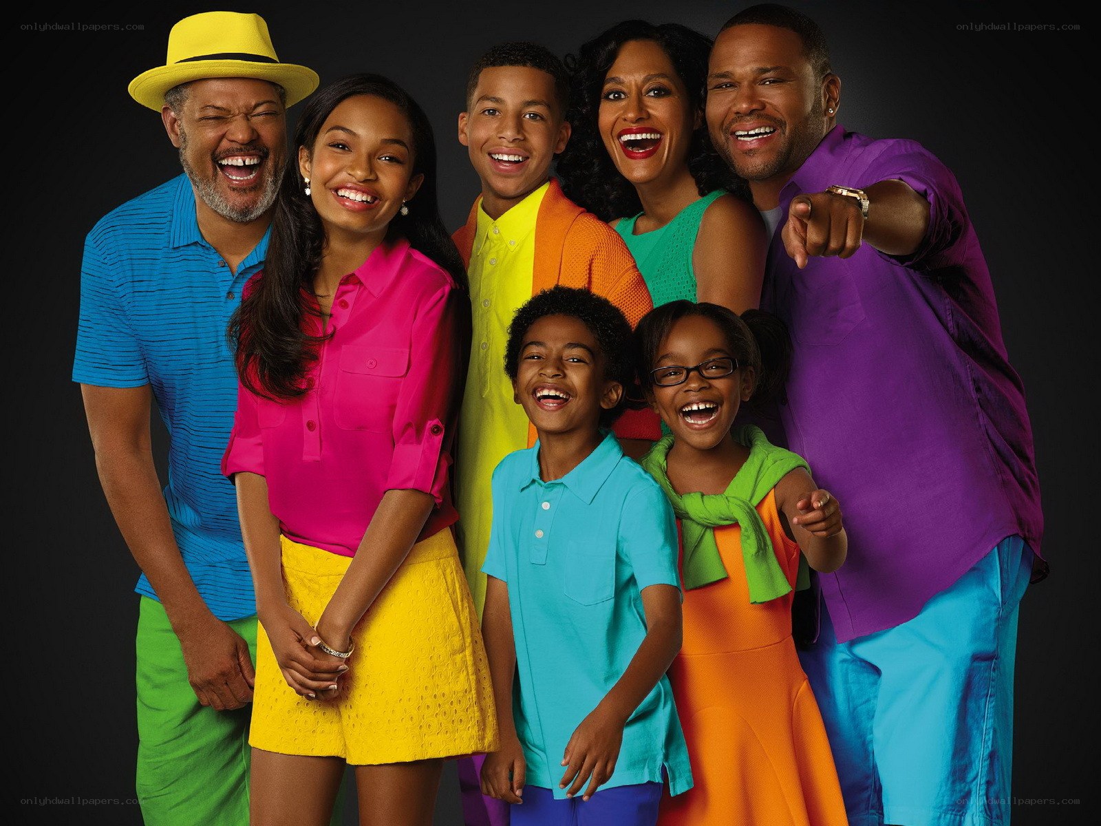 Happy family in colorful clothes
