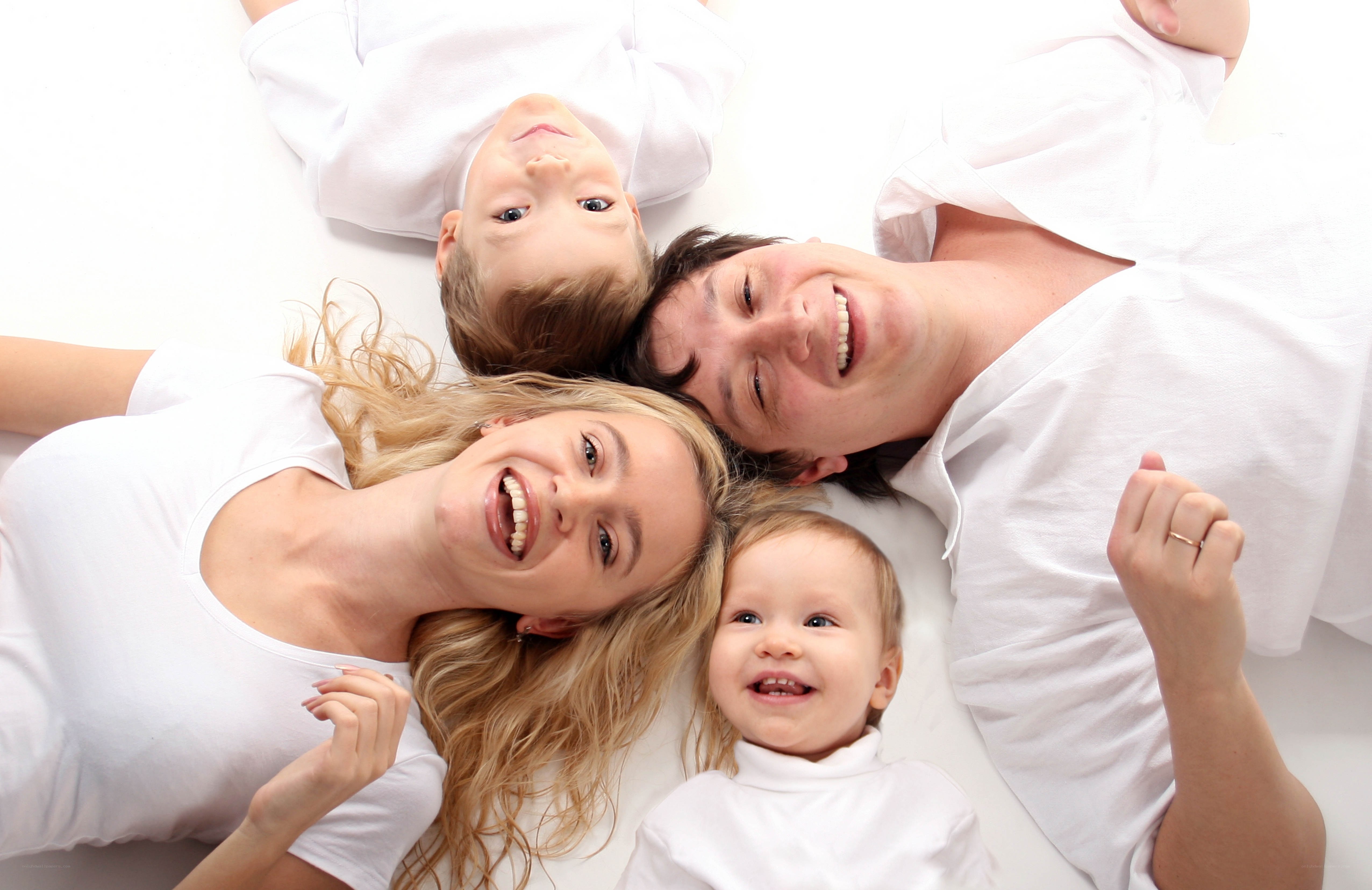 Happy family lying on floor