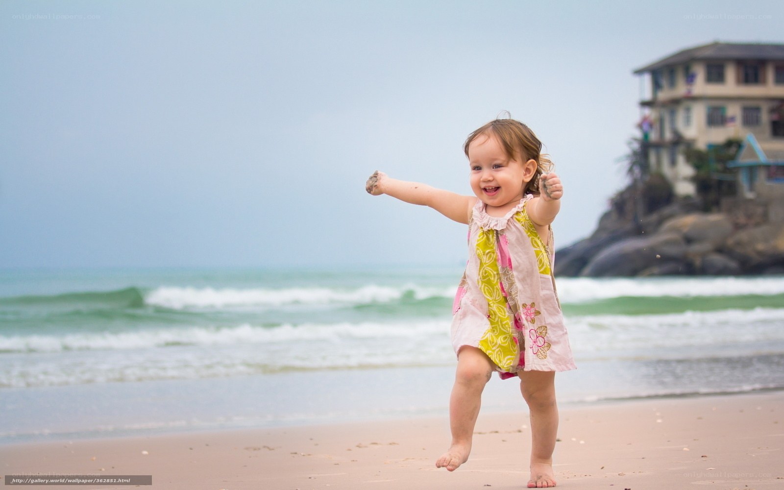 Happy toddler on the beach