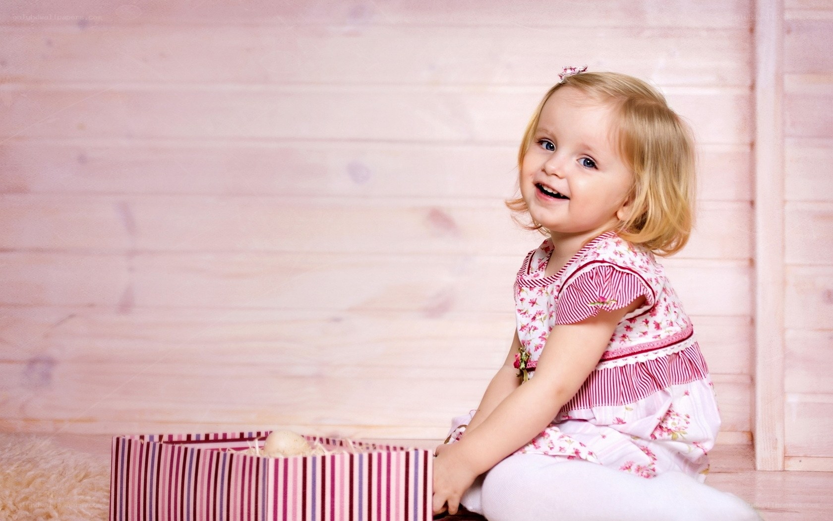 happy toddler with gift box