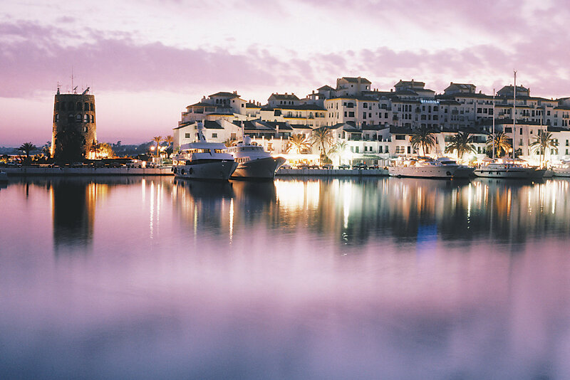 Harbor at dusk with boats and buildings