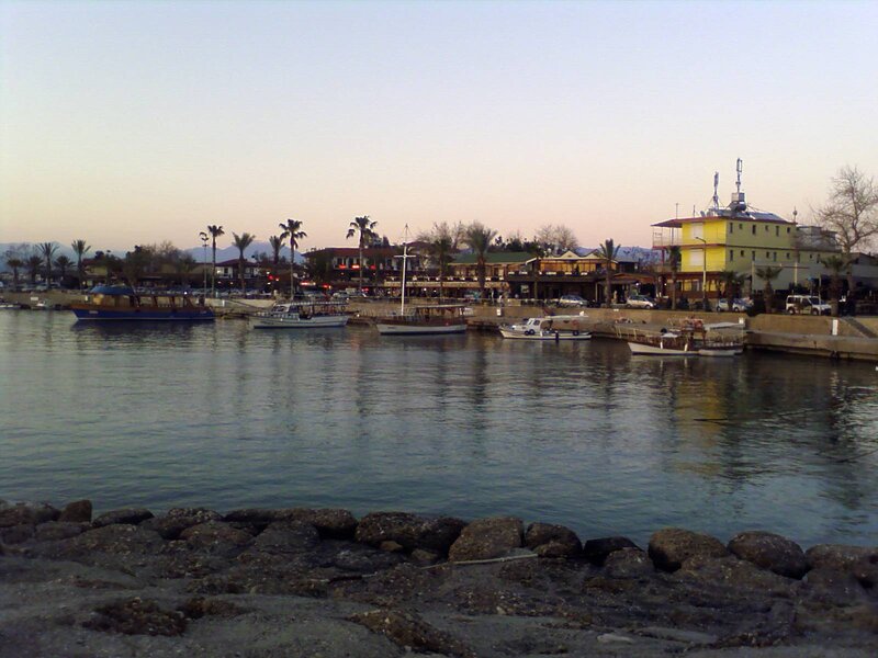 harbor at dusk with boats and buildings