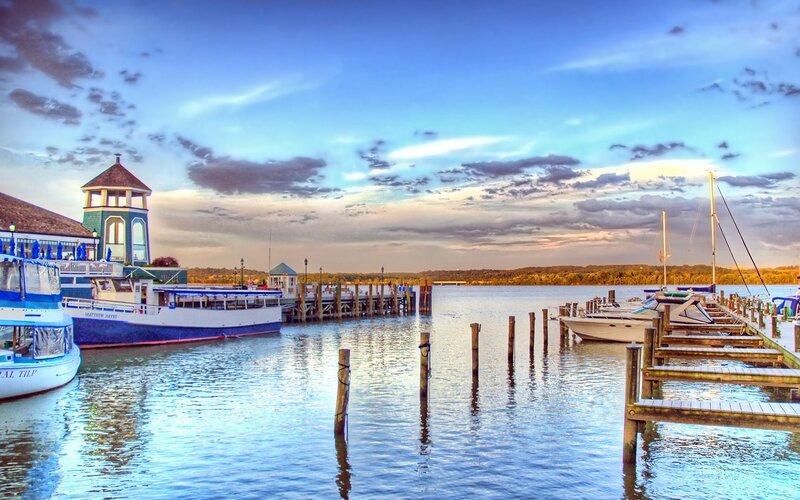 Harbor at dusk with boats and pier