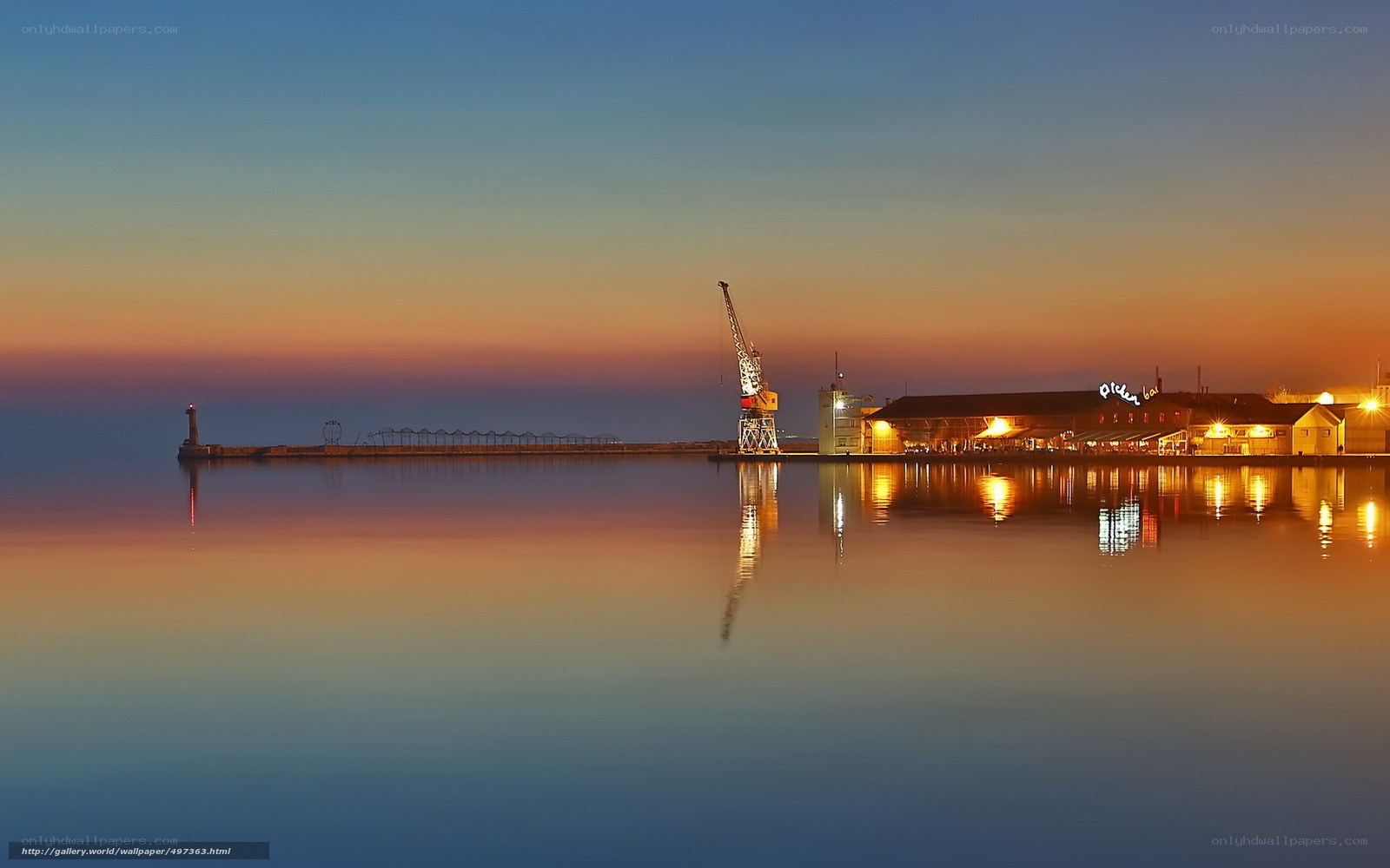 Harbor at dusk with crane