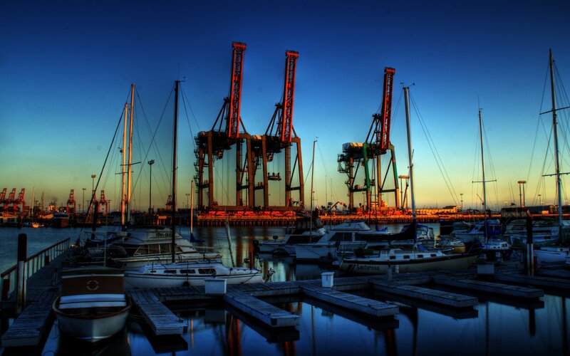 Harbor at dusk with cranes