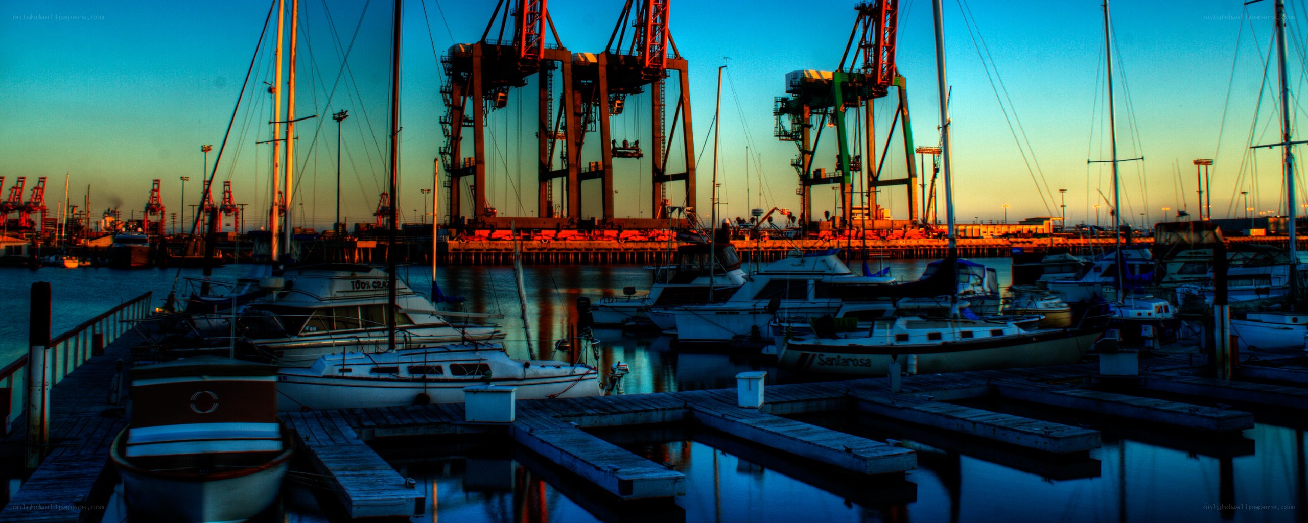 harbor at dusk with cranes