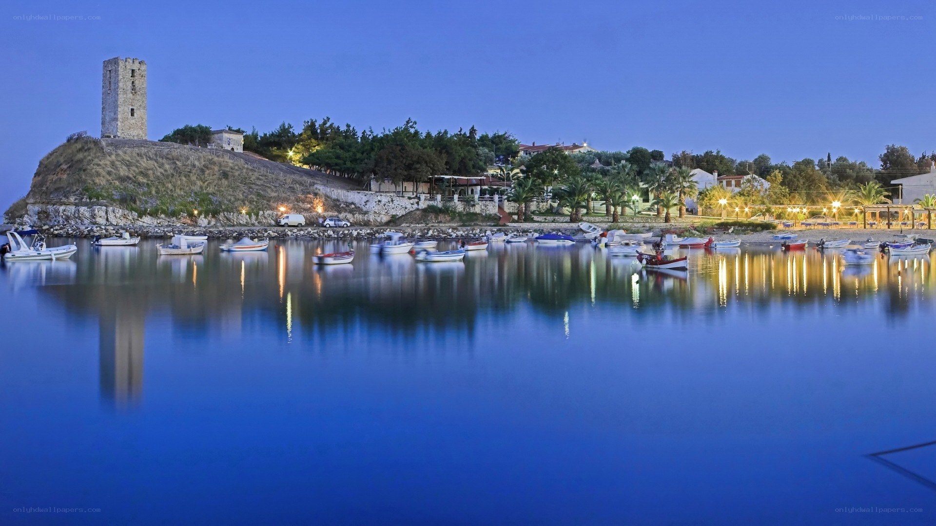 harbor at dusk with stone tower