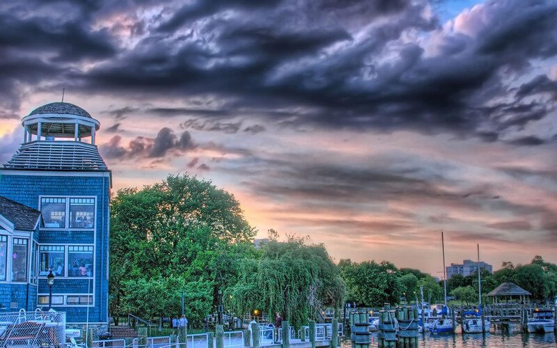 Harbor at sunset with blue building