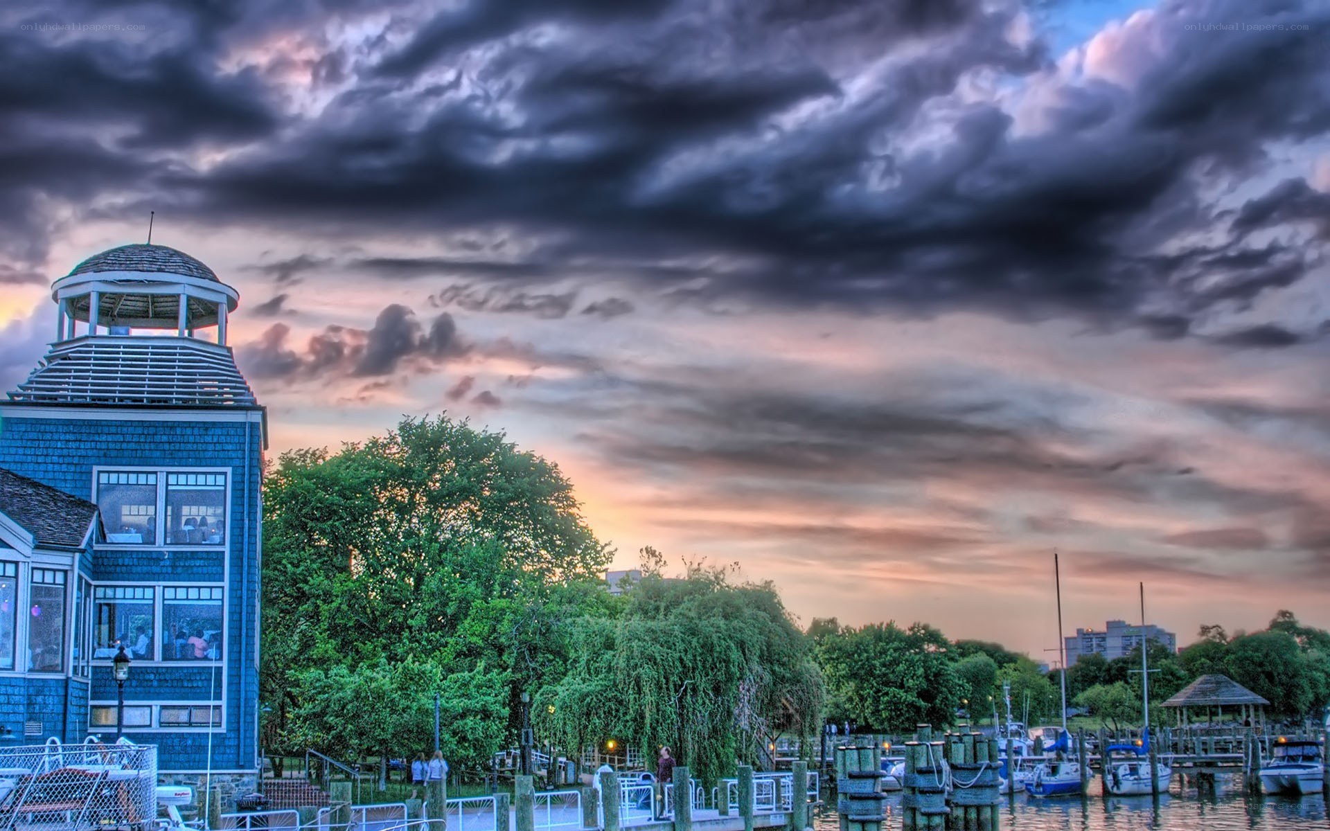 Harbor at sunset with blue building