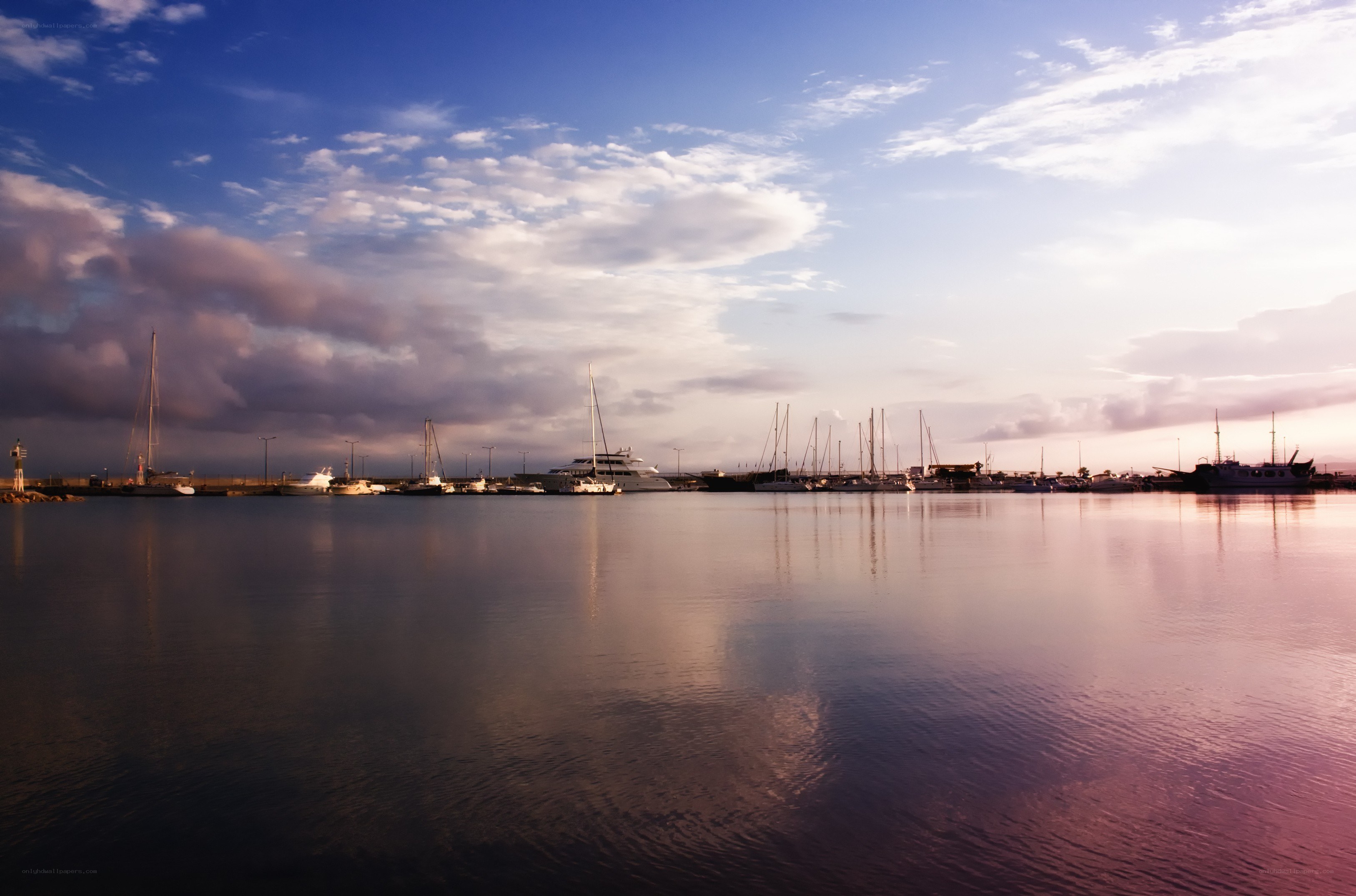 Harbor at sunset with boats