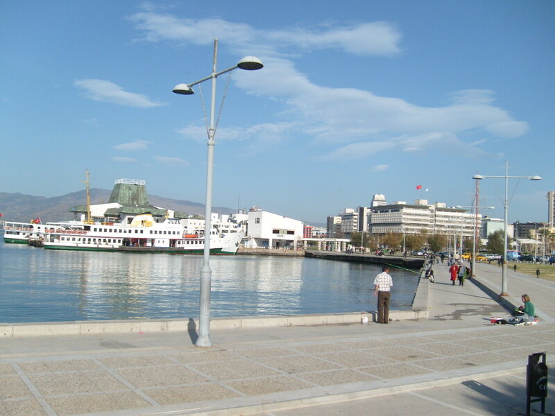 harbor scene with ferry and city