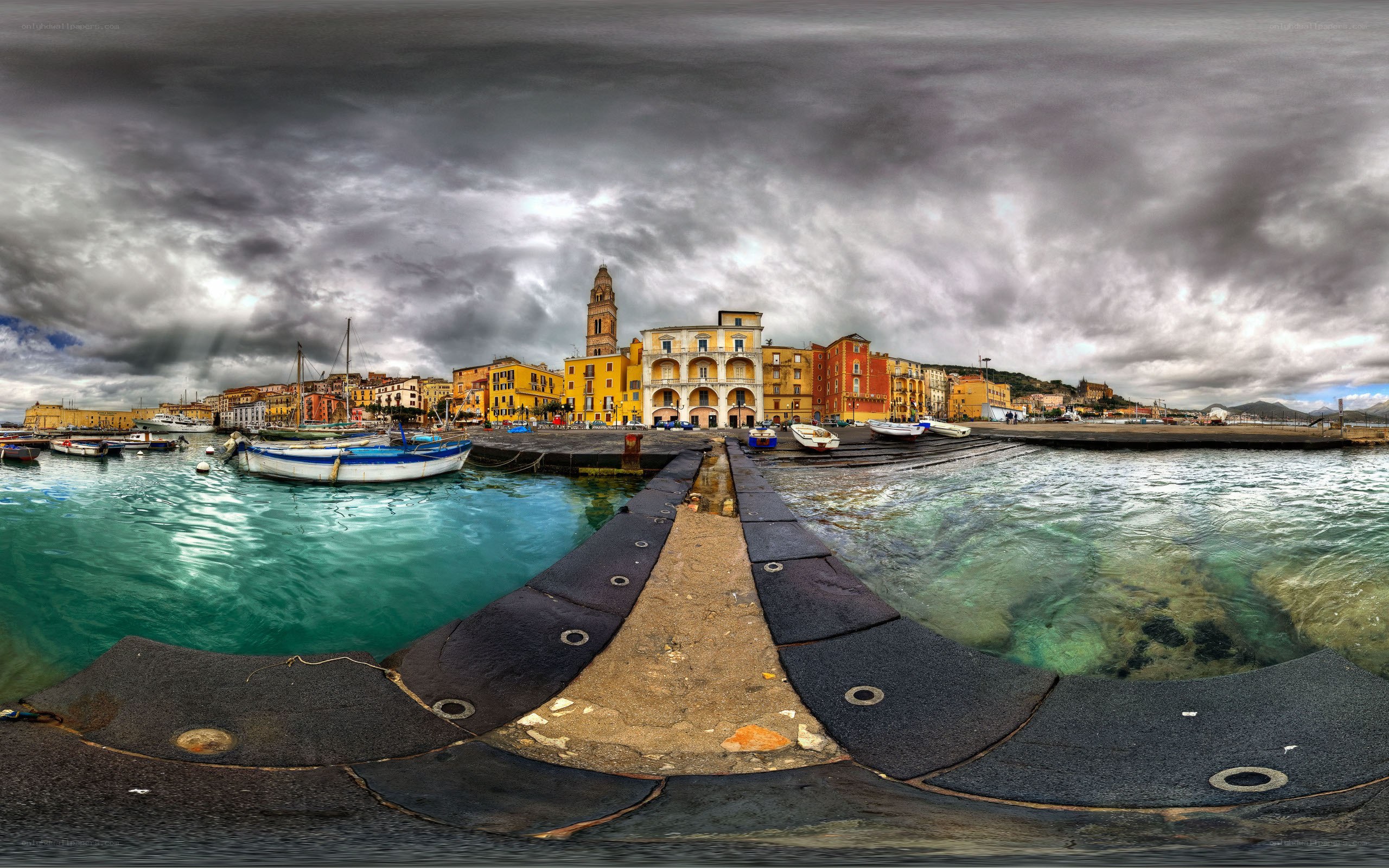 Harbor town under stormy sky