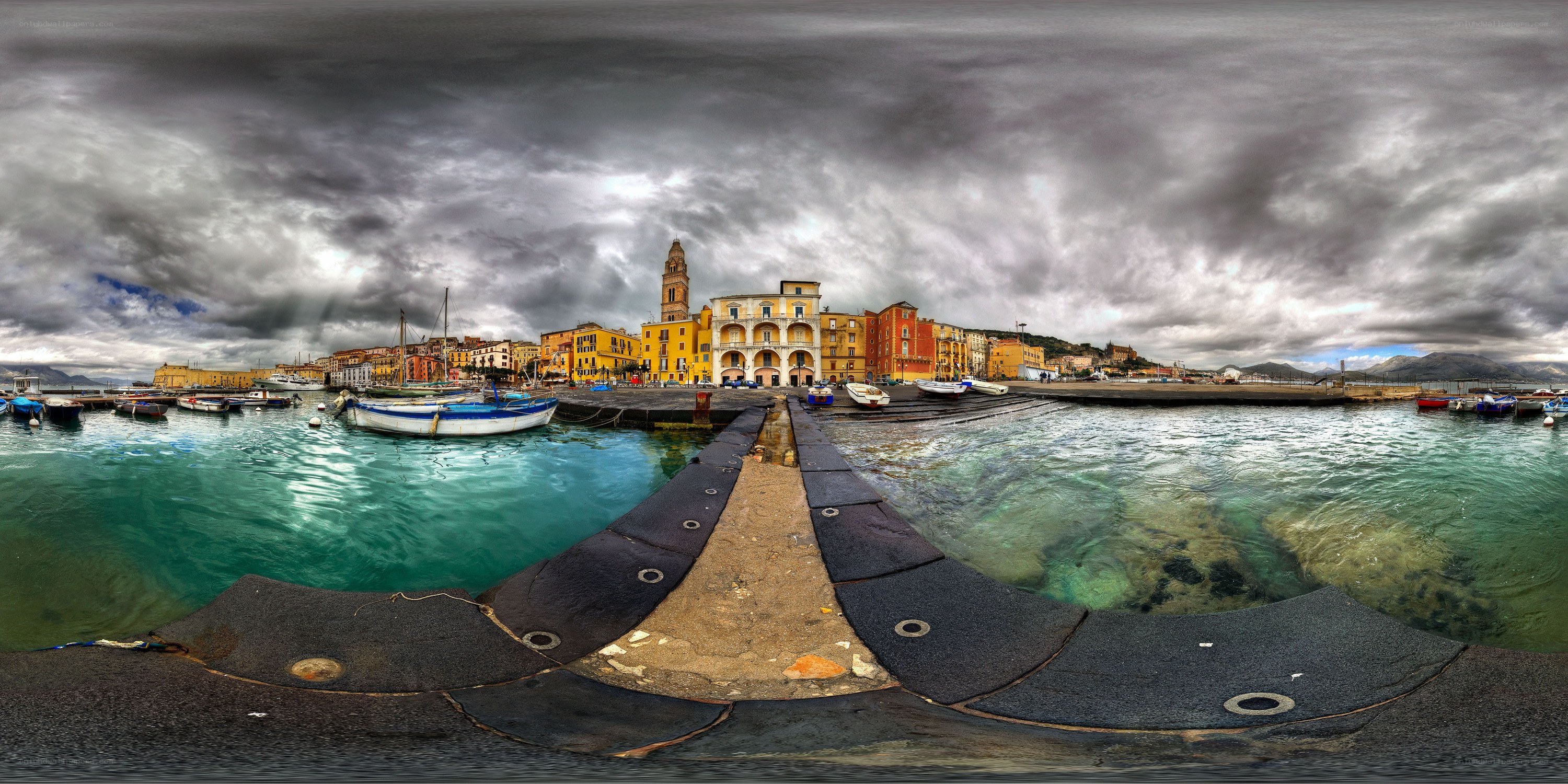 Harbor town under stormy sky