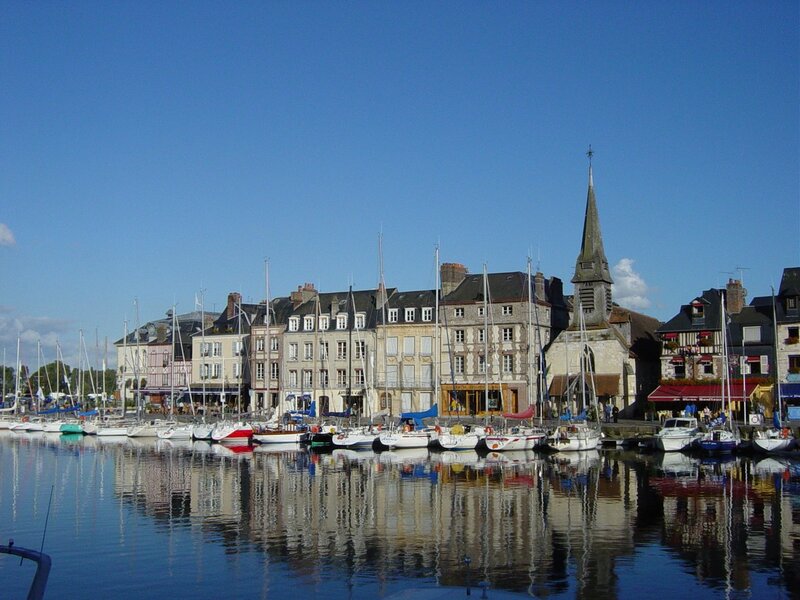 harbor town with church and boats