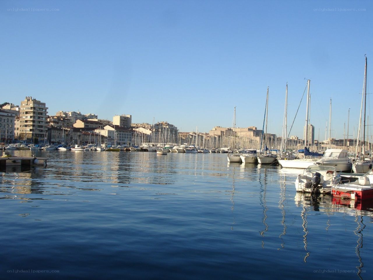 harbor with boats and city
