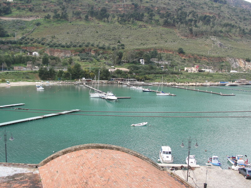 harbor with boats and hills