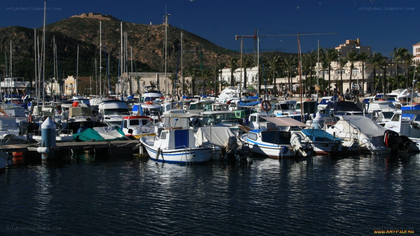 harbor with boats and mountains