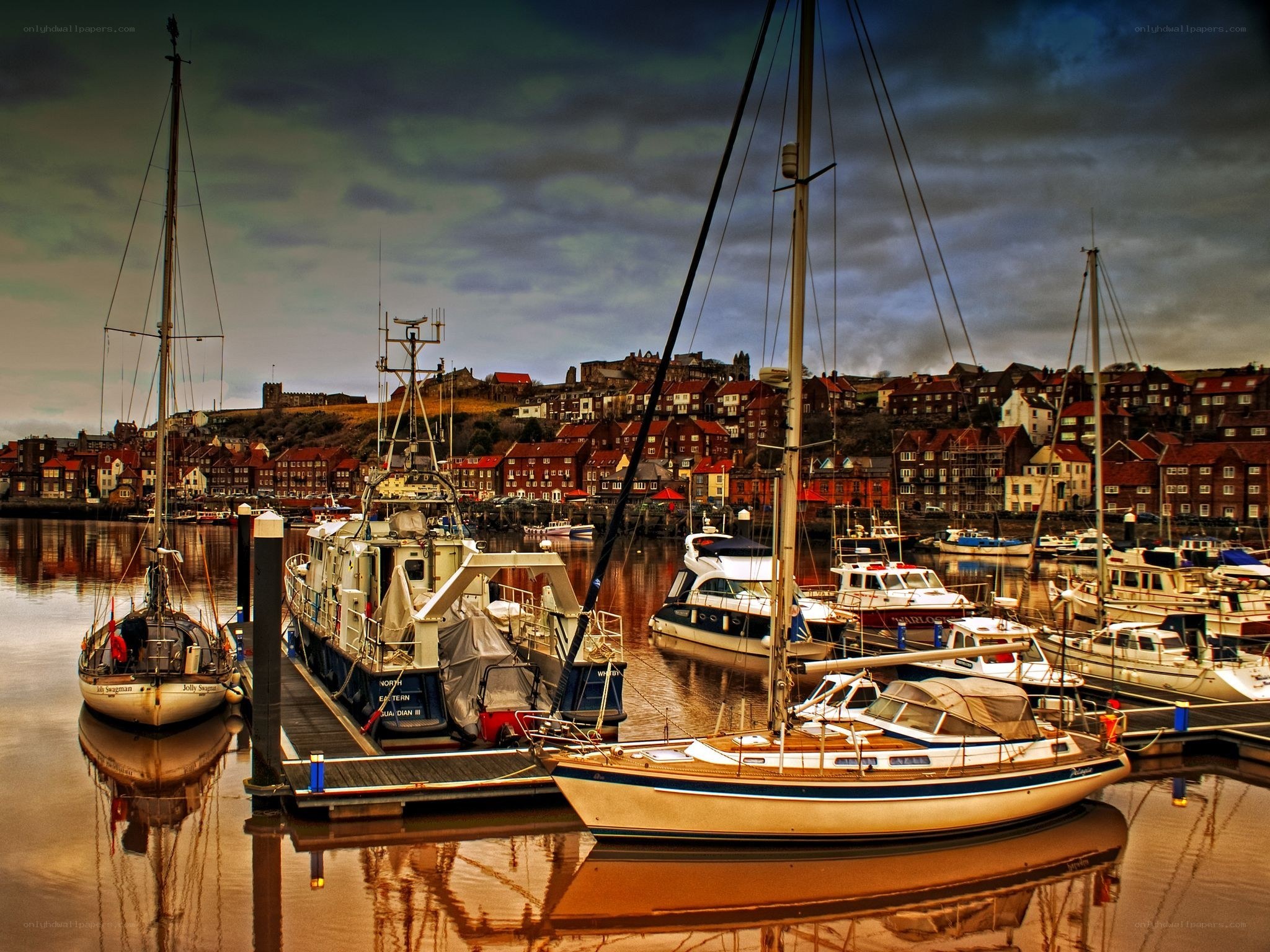 Harbor with boats and town