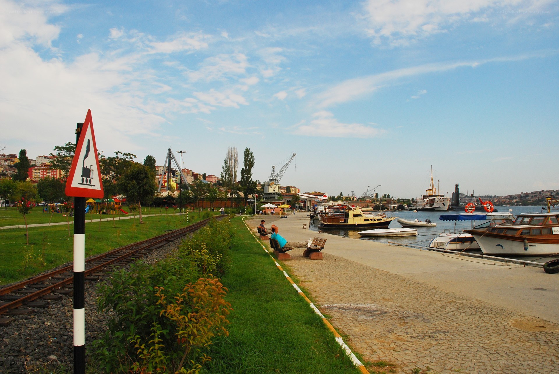 Harbor with boats and train tracks