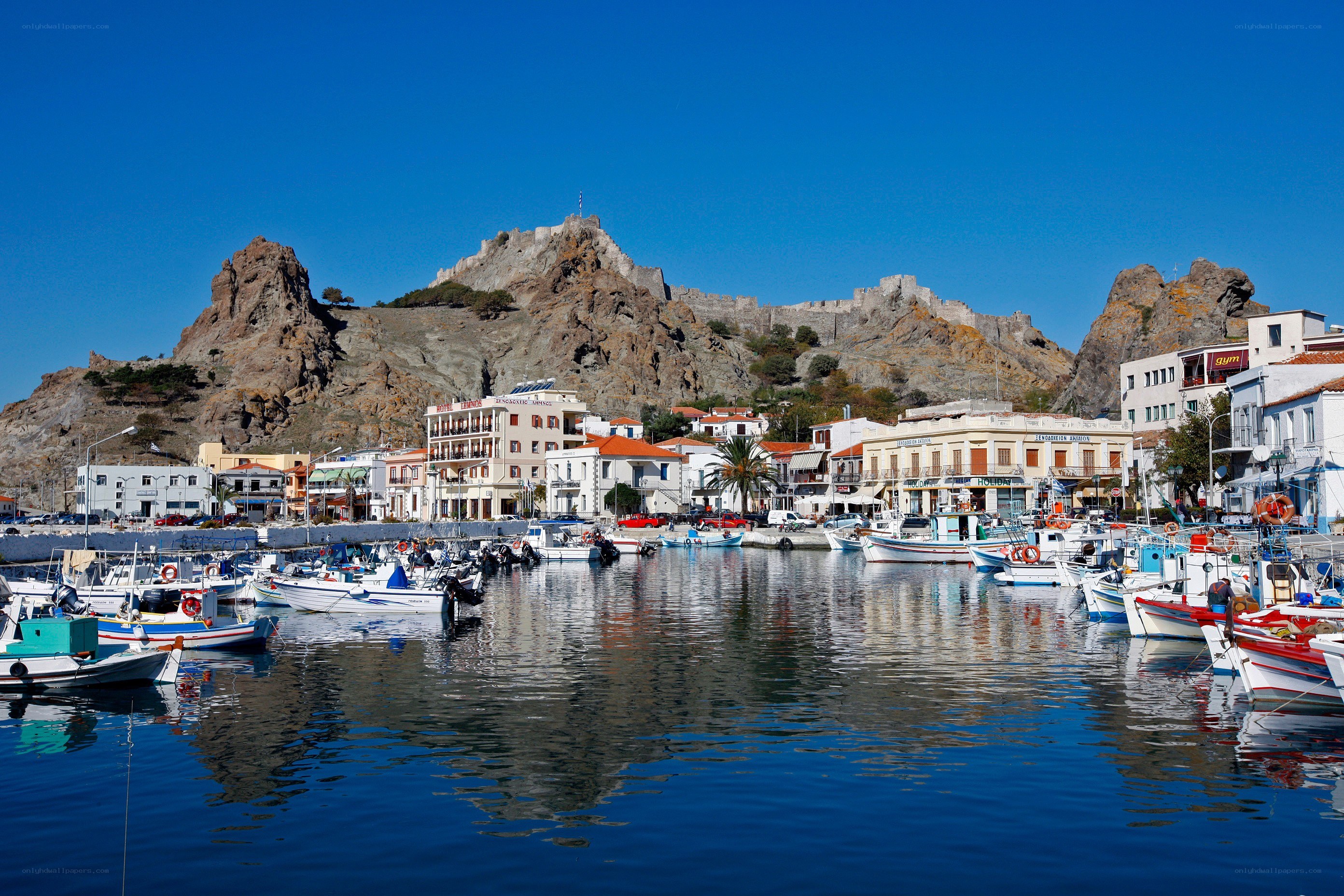 harbor with castle on hill