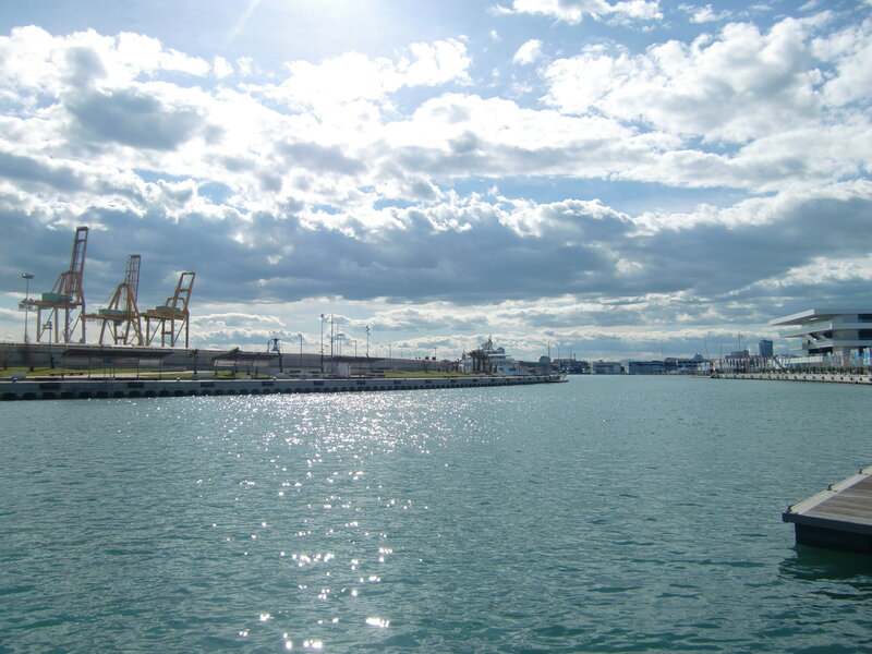 harbor with cranes and boats
