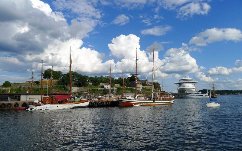 Harbor with historic boats and cruise ship