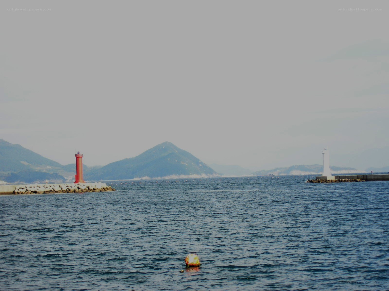 Harbor with lighthouses and mountains