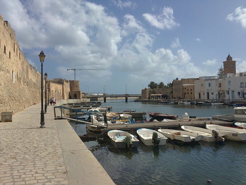harbor with old walls and boats