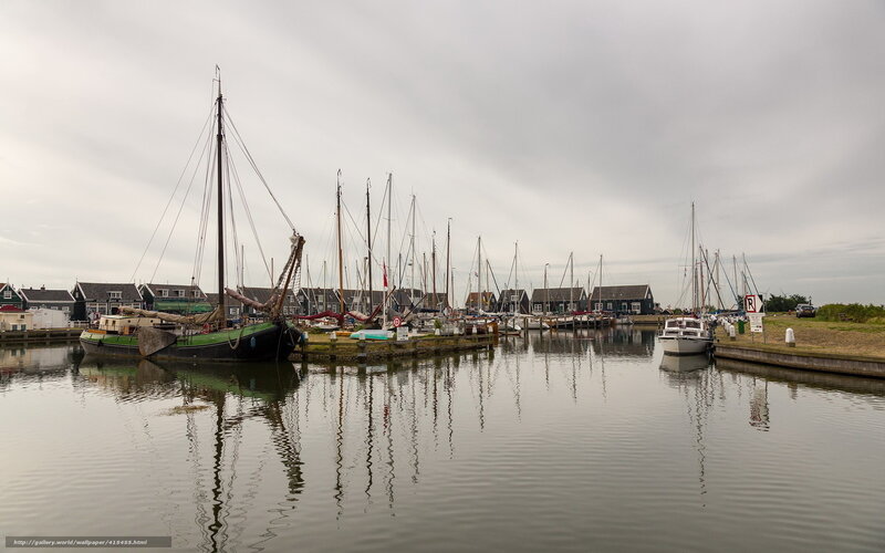 harbor with sailboats and traditional boats