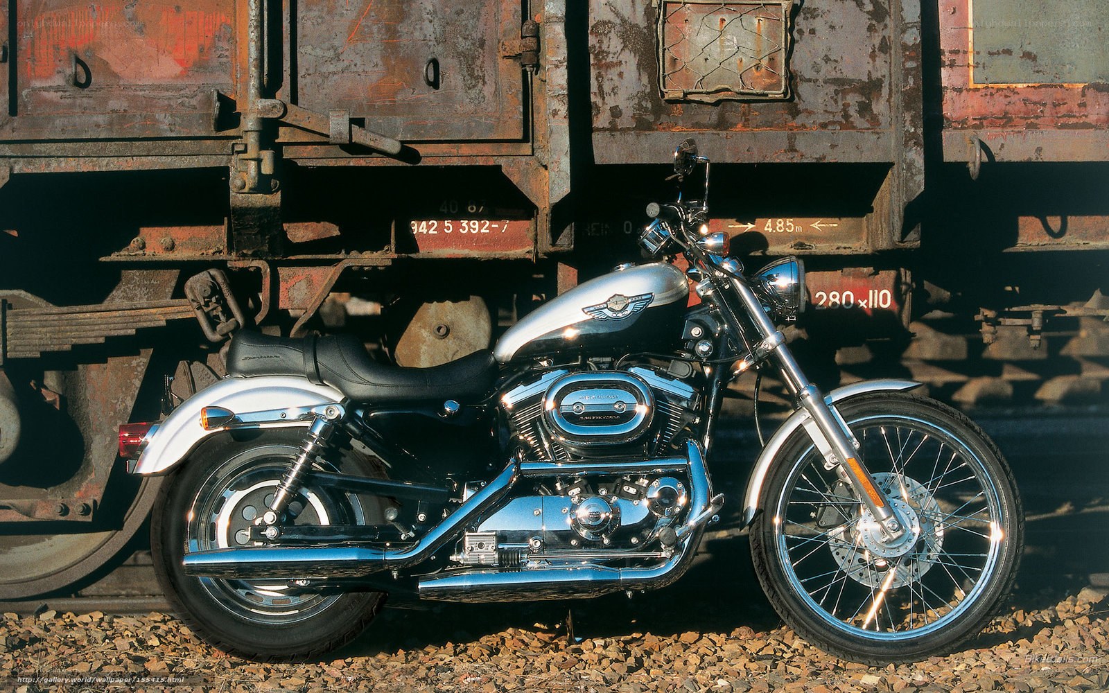 Harley-Davidson motorcycle near train