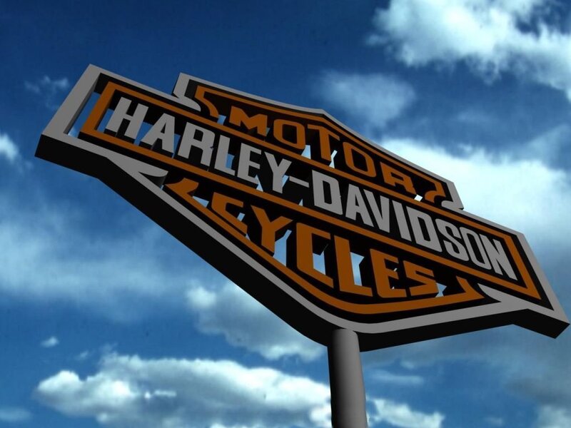 Harley-Davidson sign against sky